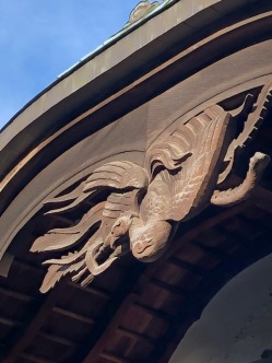 A beautiful carved phoenix over the entrance to the meeting hall